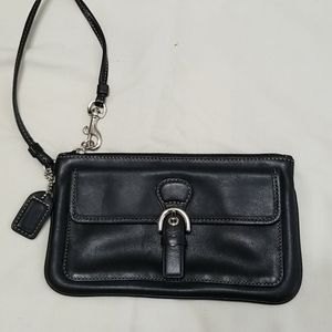 Almost Vintage Coach wristlet can hold a phone.